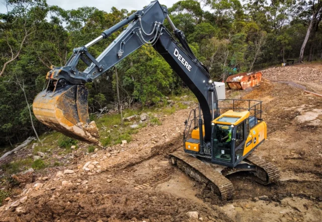 🚧 Digging deep, building strong! The John Deere E210 excavator in action